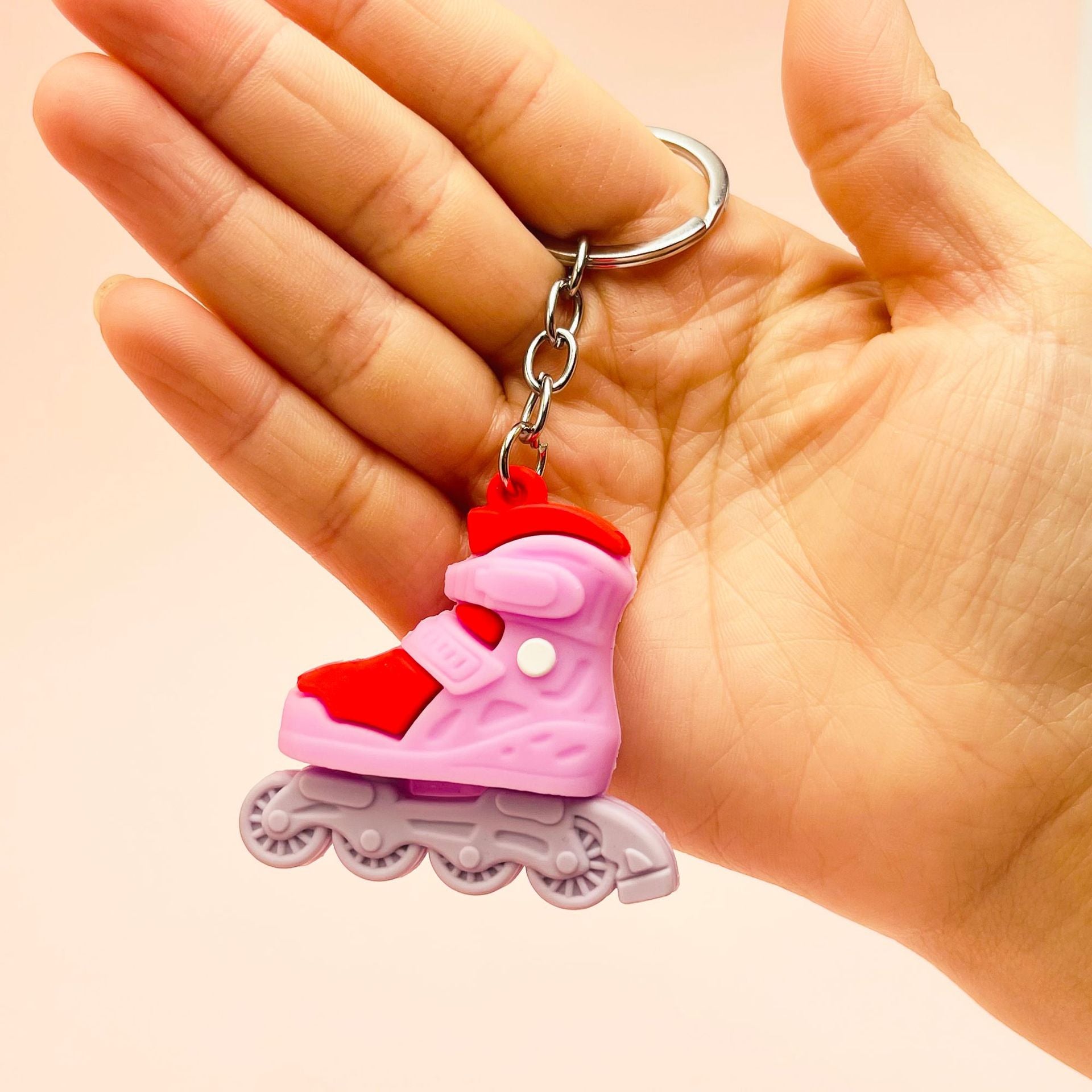 Venta al por mayor de patines de ruedas de PVC llavero creativo de plástico blando
